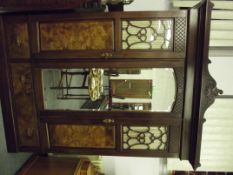 Late Victorian wardrobe in mahogany walnut veener, central bevelled mirror flanked by two doors
