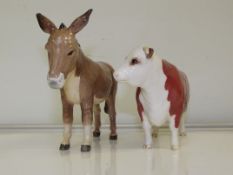 A Beswick Hereford cow, Ch. of Champions 12cm high