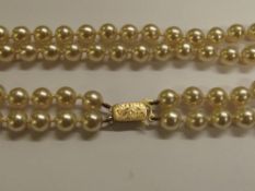 Double row cultured pearl necklace with 9 carat go
