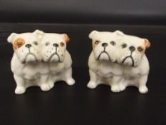 Pair of Beswick Bulldog groups modelled in a seate