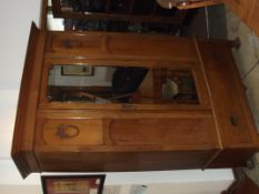 Edwardian oak mirrored wardrobe with base drawer