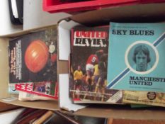 Two boxes containing early Manchester City and Man