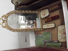 Two dressing table sets together with an easel bac
