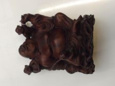 Late 19th century carved hardwood group in the for