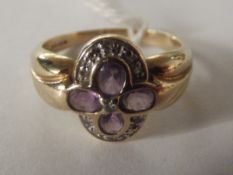 9 carat gold dress ring set with amethyst and diam