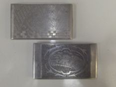 Two Eastern base metal cigarette cases each with e
