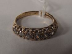 9 carat gold dress ring set with seven white gemst