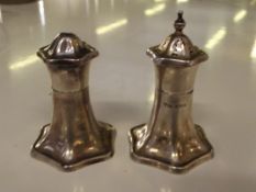 Pair of art deco silver salt and pepper pots, shap