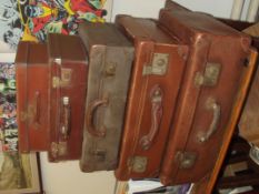 Group of five various graduating suitcases