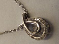 9 carat white gold pendant set with diamonds and w