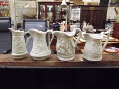 Four Portmeirion parian ware jugs