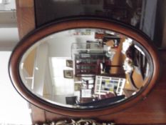 Edwardian bevel edge wall mirror set in a beaded f