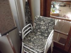 4 garden chairs together with a parasoll