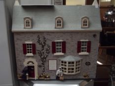 Large doll house in the form of an antique shop an