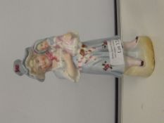 Early 20th century group, modelled as a girl with