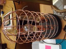 Copper table lamp in the form of a cage