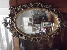 Gilt framed Rococo style wall mirror
