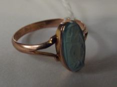 9 carat rose gold dress ring with carved blue ston