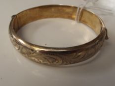 Silver hallmarked bangle, gilded with engraved dec