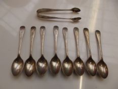 Set of eight Edwardian silver teaspoons with accom