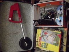 Suitcase and contents to include Vintage annuals a