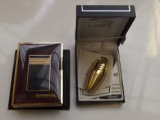Calibra cigarette lighter together with a Ronson l