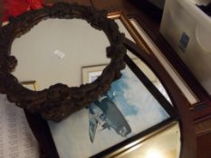 Two wall mirrors together with three prints