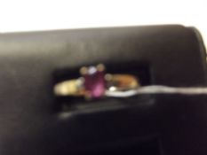 9ct gold ring with pink gem stone and diamonds