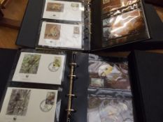 Two complete albums of First Day Covers, World Wil