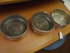Three Edwardian silver plated wine coasters
