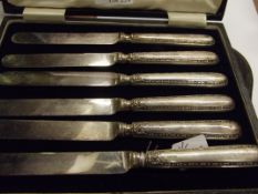 Cased set of six silver handled butter knifes