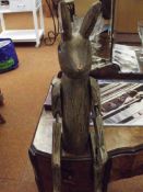 Wooden figure of a seated rabbit
