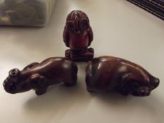 Three carved netsukes