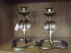 2 brass candle stick in the form of a snake
