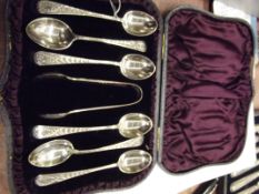 Cased set of six silver spoons with sugar tongs in