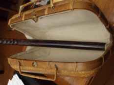 Wooden truncheon and a wicker basket