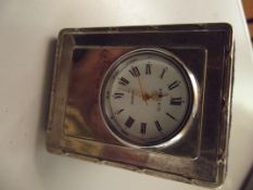 Silver cased bedside clock
