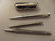Three propelling pencils, one being Booths of Bolt