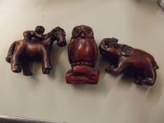 Three carved netsukes