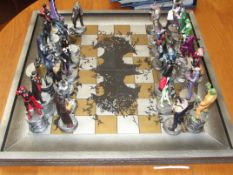 Batman chess set together with two books