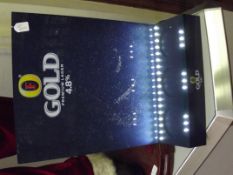Fosters gold display stand