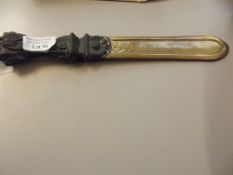 Ornate page turner with brass blade