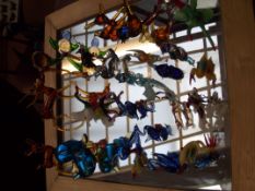 Large collection of glass animals and a mirror