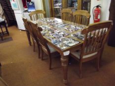 Very good quality extending dining table with four stand chairs and two carvers