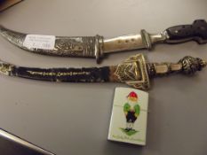 Cigarett lighter together with two Jumbiya type