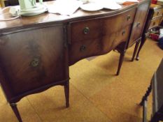 Mahogany serpentine sideboard on tapered supports