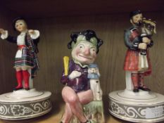 Two musical figures together with a Toby jug