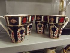 Set of four Royal Crown Derby mugs