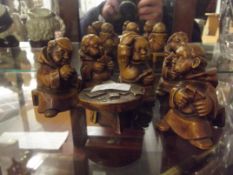 Treen figures in the form of Monks playing cards