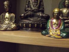 Four brass Thai Buddhas